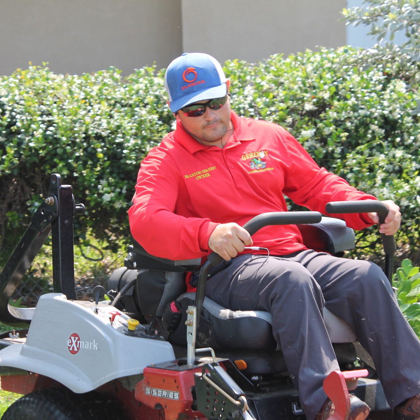 Gerzeny Landscape Services owner Brandon Gerzeny mows lawn in Osprey Florida